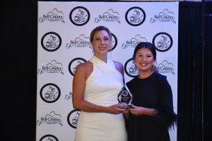 BUSINESSWOMAN OF THE YEAR AWARD WINNER GINA WILSON (LEFT) OF SAUCED PICTURED WITH BELL COUNTY CHAMBER DIRECTOR MELISSA TURNER (RIGHT)